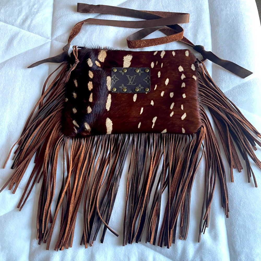 Upcycled LV cowhide crossbody bag.  Adjustable strap, fringe, gorgeous color.